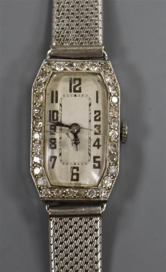 A ladys platinum and diamond set manual wind cocktail watch, on a 9ct white gold mesh bracelet.